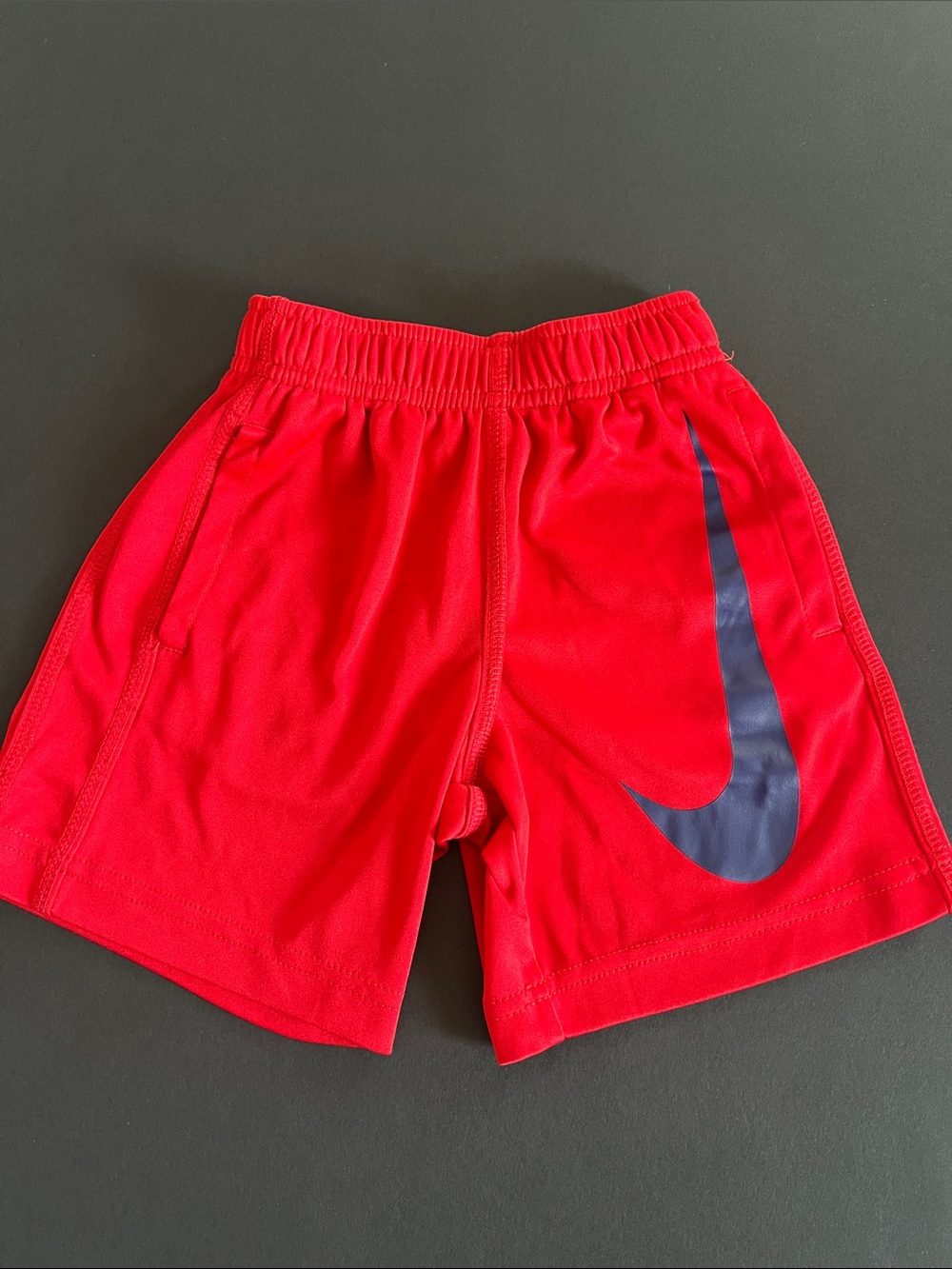 Nike Kids Red Athletic Shorts with Navy Swoosh
